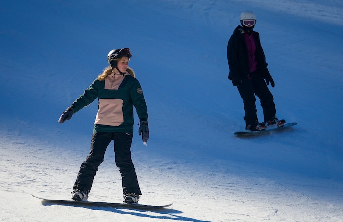 (Bethany Baker  |  The Salt Lake Tribune) Two snowboarders recreate at Sundance Resort near Provo on Thursday, Dec. 14, 2023.