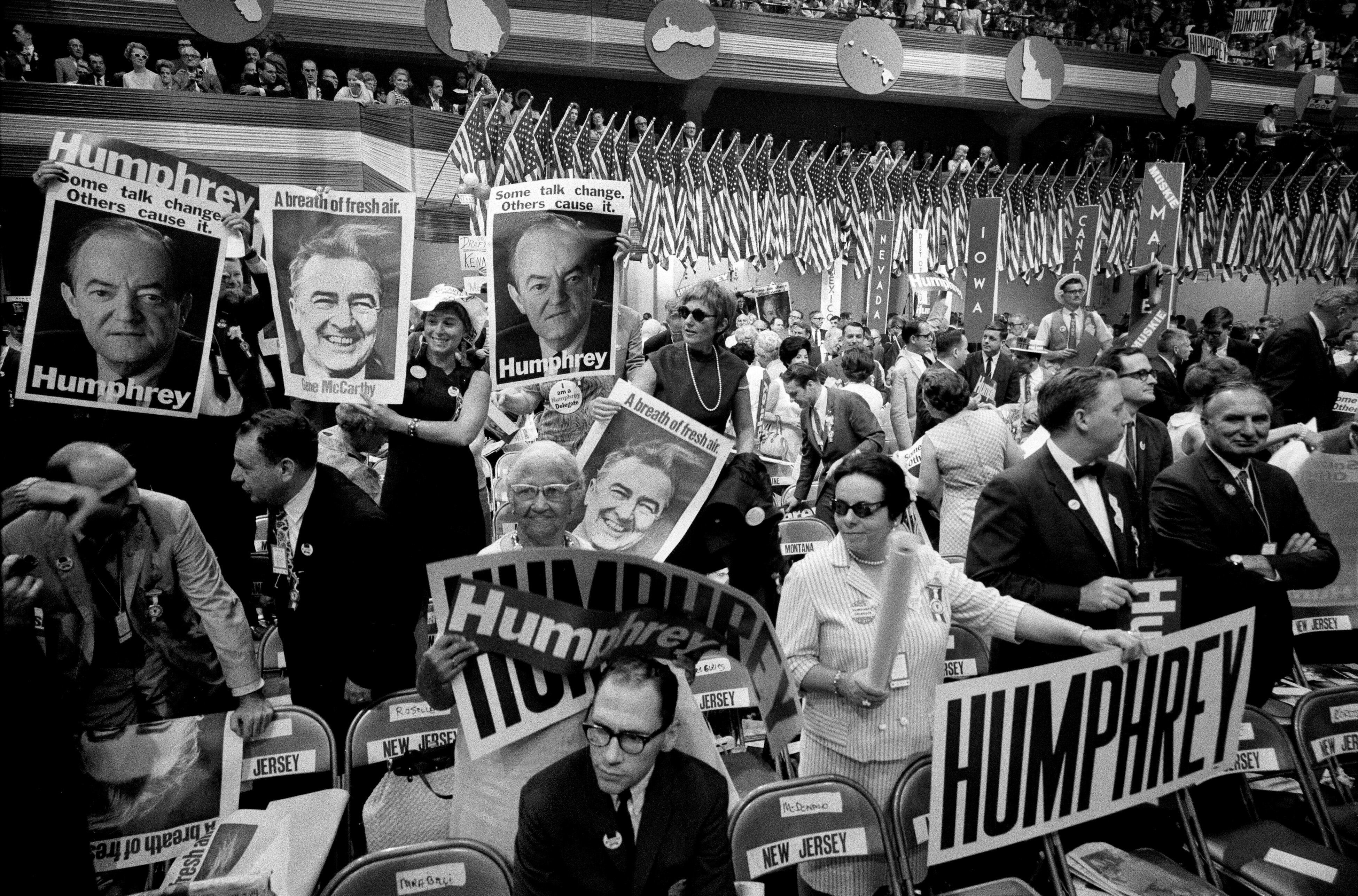 (Barton Silverman | The New York Times) Attendees at the Democratic National Convention in Chicago, Aug. 28, 1968. The violent clashes in Chicago between demonstrators and the police during the convention produced one of the most polarizing showdowns of the 1960s. Delegates selected Vice President Hubert Humphrey as its presidential nominee over the anti-Vietnam War candidate Eugene McCarthy.