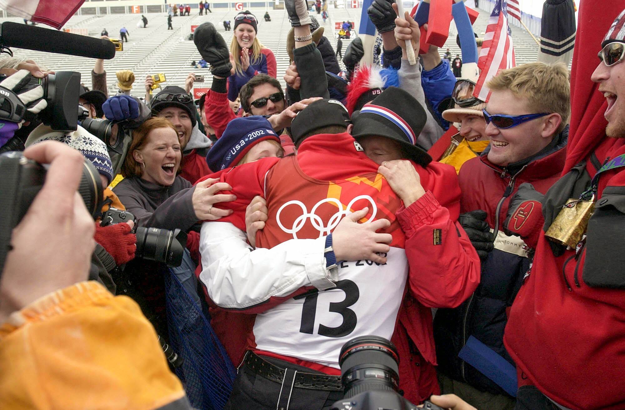 (Paul Fraughton | The Salt Lake Tribune) Joe Pack of the United States is hugged by his family and friends after his silver medal performance in the men’s aerials during the 2002 Winter Olympics at Deer Valley Resort, Feb. 19, 2002.
