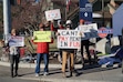 (Kristine Weller | KPCW) Members of the Park City Professional Ski Patrol Association and their supporters picket at the Deer Valley Drive and Park Avenue intersection. It's not an official strike.