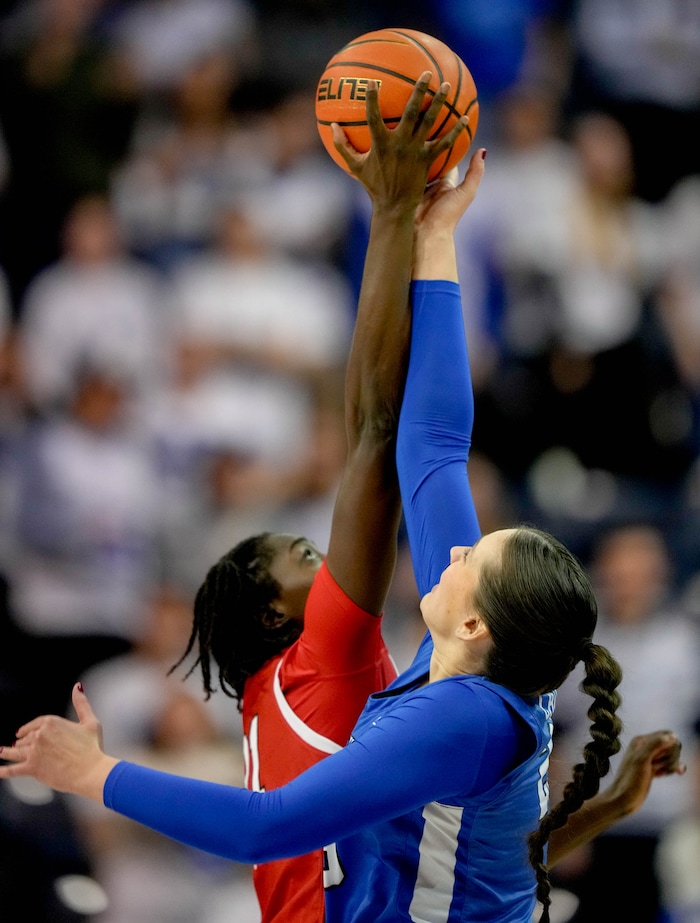 (Francisco Kjolseth  | The Salt Lake Tribune) Utah Utes forward Maye Toure (21) goes up against BYU Cougars forward Emma Calvert (25) for the opening ball as BYU hosts Utah, NCAA basketball in Provo on Saturday, Jan. 25, 2025.