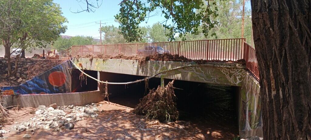 (Doug McMurdo for The Salt Lake Tribune) Mill Creek spilled over the road on 300 South in Moab.