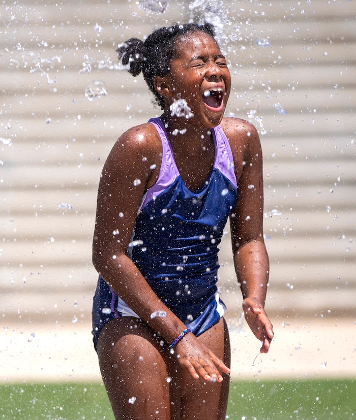 (Rick Egan | The Salt Lake Tribune)  London Larkin plays in the fountain at The Gateway mall during a Juneteenth Celebration on Monday, June 19, 2023.