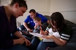 (Trent Nelson  |  The Salt Lake Tribune) Megan and Kaden Mattinson work with their homeschooled children Colten and Aspen in Springville on Thursday, May 9, 2024. Rather than a flat $8,000 scholarship for everyone, Utah’s homeschoolers could see less funding than those attending private schools.