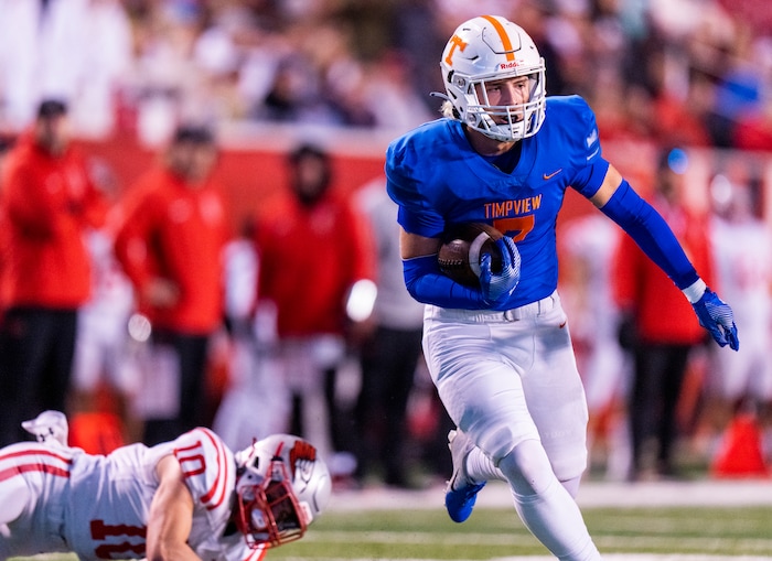 (Rick Egan | The Salt Lake Tribune)   Jackson Farrar
 (7), runs the ball for Timpview as Evan Dehart defends for Bountiful, in 5A State playoff action between the Timpview Thunderbirds and the Bountiful Redhawks, at Rice-Eccles Stadium, on Friday, Nov. 17, 2023.
