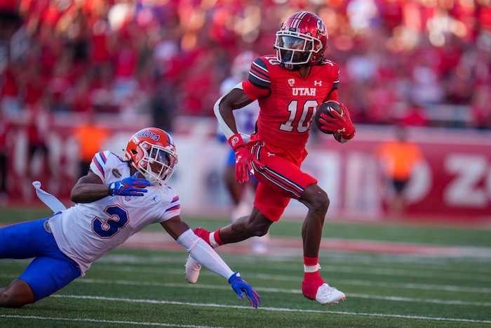 (Trent Nelson  |  The Salt Lake Tribune) Utah Utes wide receiver Money Parks (10) runs for a touchdown as the Utah Utes host the Florida Gators, NCAA football in Salt Lake City on Thursday, Aug. 31, 2023. At left is Florida Gators cornerback Jason Marshall Jr. (3).