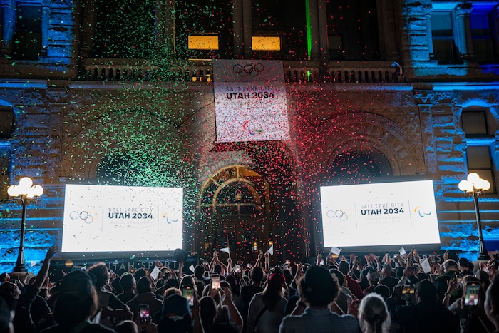 (Rick Egan | The Salt Lake Tribune) Crowds cheer as Salt Lake City is announced as hosts for the 2034 Winter Olympics at Salt Lake City Hall, Wednesday, July 24, 2024.