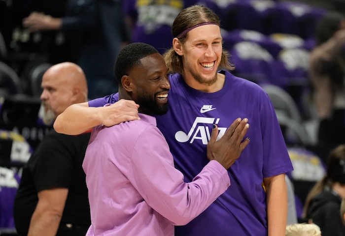 (Francisco Kjolseth  |  The Salt Lake Tribune) Utah Jazz minority owner Dwyane Wade, left, embraces Utah Jazz forward Kelly Olynyk (41) during NBA basketball in Salt Lake City on Wednesday, Oct. 25, 2023.