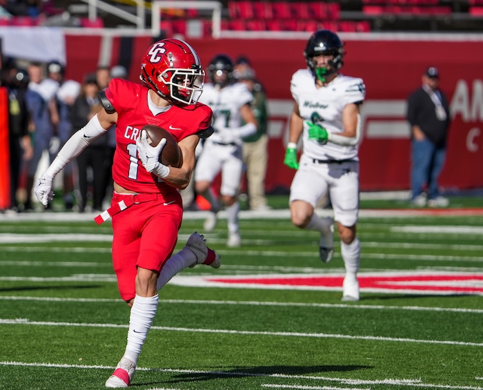 (Chris Samuels | The Salt Lake Tribune) Crimson Cliffs wide receiver Tyler West catches the first play of the game for a touchdown during the 4A high school football championship game against Green Canyon at Rice-Eccles Stadium, Friday, Nov. 17, 2023.