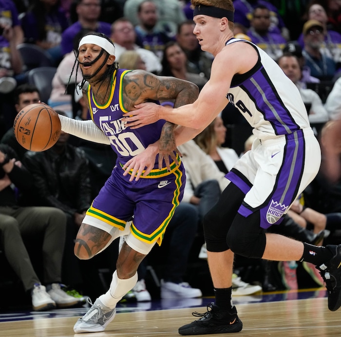 (Francisco Kjolseth  |  The Salt Lake Tribune) Utah Jazz guard Jordan Clarkson (00) pushes past Sacramento Kings guard Kevin Huerter (9) during NBA basketball in Salt Lake City on Wednesday, Oct. 25, 2023.