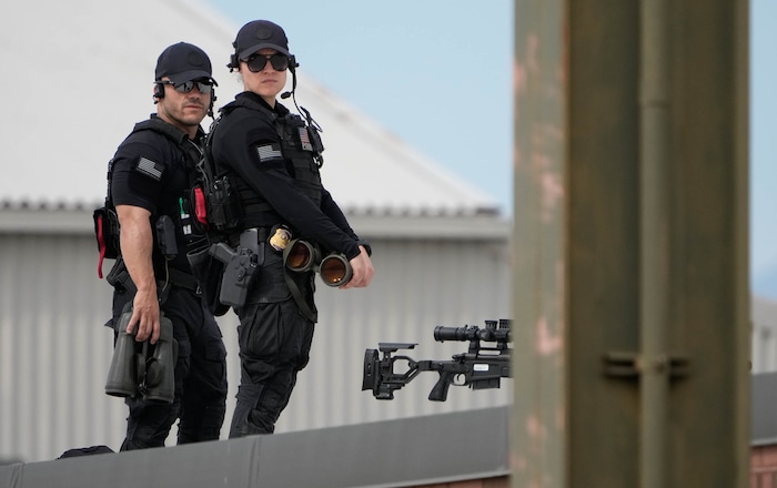 (Francisco Kjolseth | The Salt Lake Tribune) Presidential security takes up positions as Air Force One lands at Roland R. Wright Air National Guard Base as President Joe Biden visits Utah on Wednesday, Aug. 9, 2023.