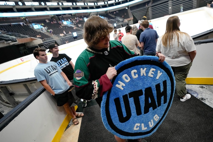 (Francisco Kjolseth  |  The Salt Lake Tribune) Hockey fan Dylan Malstrom shows off the hand-tufted rug he made as the Utah Hockey Club hosts their first NHL draft party at the Delta Center on Friday, June 28, 2024.