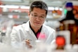 (Francisco Kjolseth | The Salt Lake Tribune) Researcher Zhenjian Lin works in his lab at the University of Utah on Thursday, June 9, 2022, where he and other researchers found a way to produce a potential anti-cancer compound found in coral. The researcher has had some of his work funded by the National Institutes of Health, but a 2025 directive from the Trump administration could reduce how much money schools get to cover research expenses. 