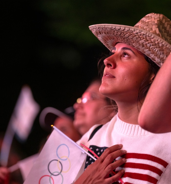 (Rick Egan | The Salt Lake Tribune)  Miya Snow watches a live stream at Salt Lake City Hall of the vote to host the 2034 Winter Olympics, on Wednesday, July 24, 2024.