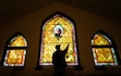 (Francisco Kjolseth  | The Salt Lake Tribune) Mike Green, chair of the trustees for First United Methodist Church in Salt Lake City, points out some of the damage the stained-glass windows, original to the 1906 building, have sustained over the years. Efforts are now underway to preserve the artworks, although the congregation has yet to raise enough to cover the full cost of repairs.