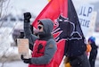 (Francisco Kjolseth  | The Salt Lake Tribune) Park City ski patroller Mike Reilly, alongside a sabo cat flag, a symbol of labor organizing, joins other patrollers as they officially go on strike early Friday, Dec. 27, 2024. Citing unfair labor practices and marking the latest chapter in the union’s negotiations with Park City Mountain and its owner, Vail Resorts the patrollers took up the fight at several locations in Park City.