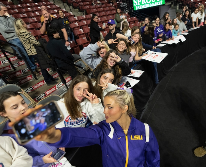 (Rick Egan | The Salt Lake Tribune)  LSU gymnast Livvy Dunne takes a selfie with fans after a gymnastics meet between Utah, LSU, Oklahoma and UCLA at the Maverik Center, on Saturday, Jan. 13, 2024.
