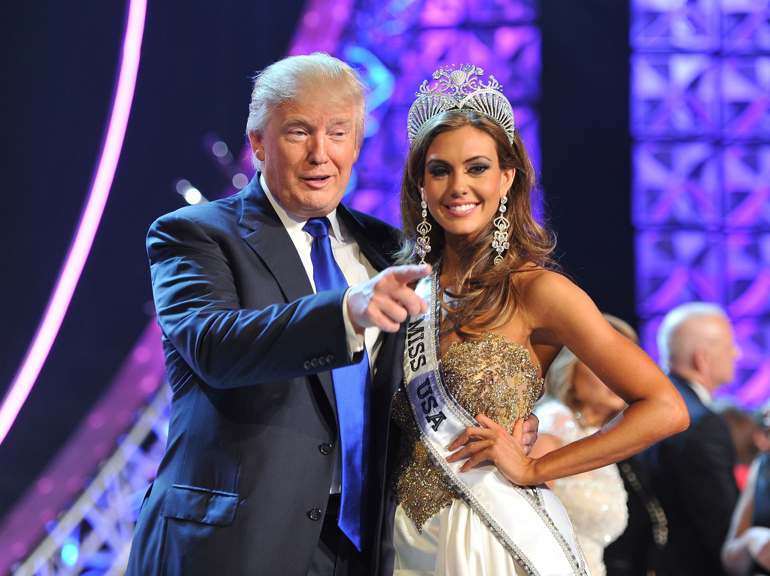 (Jeff Bottari | AP) In this June 16, 2013, file photo, Donald Trump, left, and Miss Connecticut USA Erin Brady pose onstage after Brady won the 2013 Miss USA pageant in Las Vegas. 