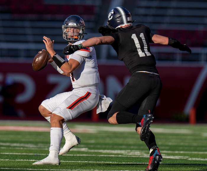 (Rick Egan | The Salt Lake Tribune)  Corner Canyon Defensive End Sam Chandler puts pressure on Skyridge QB Jackson Stevens, in 6A State playoff action between the Corner Canyon Chargers and the Skyridge Falcons, at Rice-Eccles Stadium, on Friday, Nov. 17, 2023.