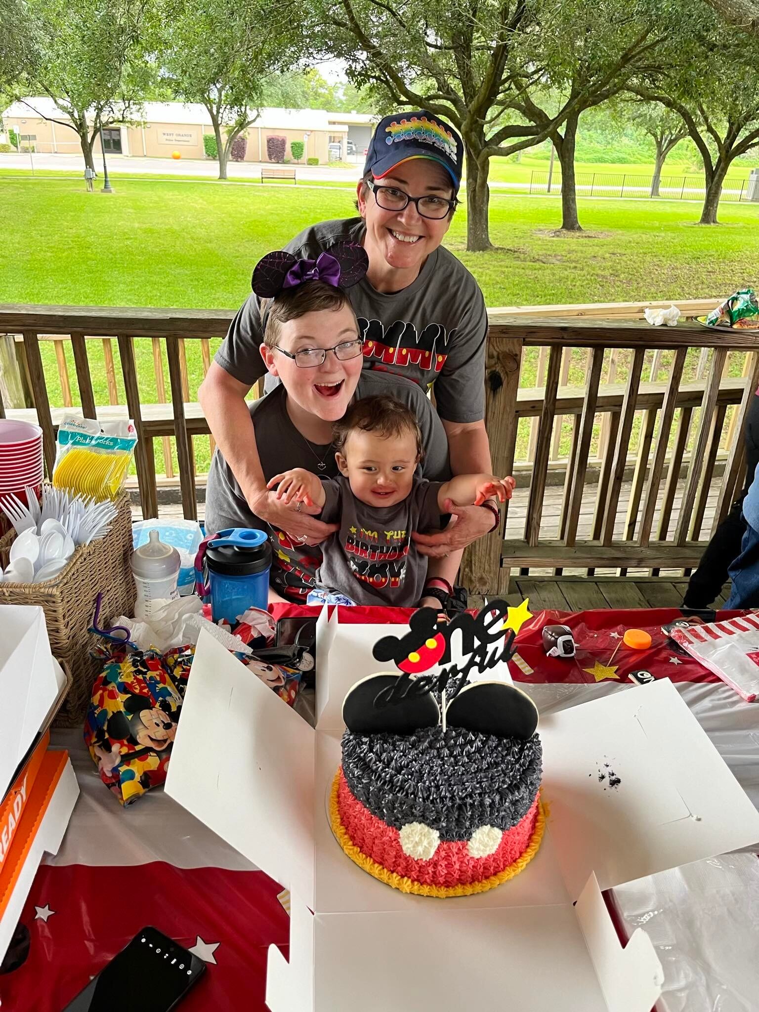 (Janette Petersen) Janette Petersen, middle, and wife Tammy celebrate their son's first birthday. Petersen's membership was withdrawn earlier this year after she refused to seek a divorce.