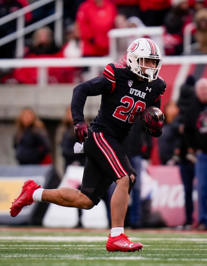 (Bethany Baker  |  The Salt Lake Tribune) Utah Utes safety Sione Vaki (28) runs the ball against the Colorado Buffaloes at Rice-Eccles Stadium in Salt Lake City on Saturday, Nov. 25, 2023.