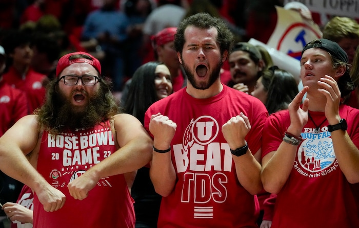 (Bethany Baker  |  The Salt Lake Tribune) Utah Utes fans react after the victory over the Brigham Young Cougars at the Jon M. Huntsman Center in Salt Lake City on Saturday, Dec. 9, 2023.