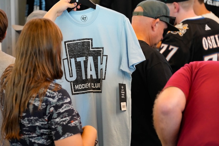 (Francisco Kjolseth  |  The Salt Lake Tribune) People purchase merchandise as the Utah Hockey Club hosts their first NHL draft party at the Delta Center on Friday, June 28, 2024.