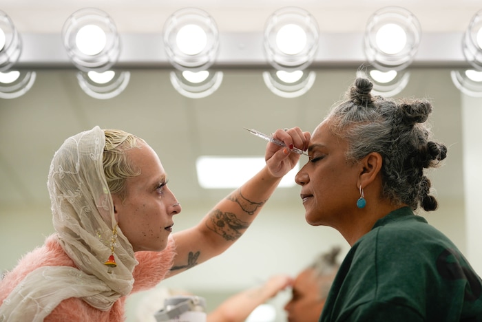 (Francisco Kjolseth | The Salt Lake Tribune) Tiny Queen helps model Tracey Mapstone prepare for her walk showcasing the work of L’Amoure Ferrer at the Eccles Theater on Friday, July 21, 2023.  