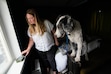 (Francisco Kjolseth  | The Salt Lake Tribune) Tegan Spangrude, a west side resident who allowed an air monitoring device to be installed in her home, is joined by her dog Snowman as she talks about the experience on Monday, August. 12, 2024.