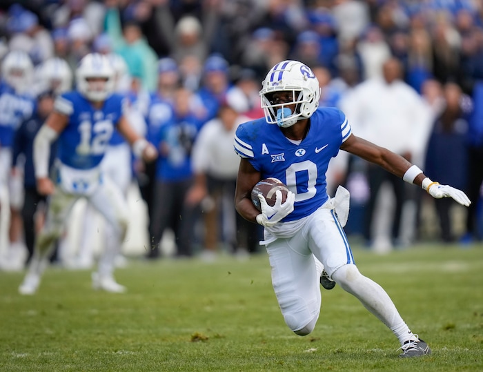 (Bethany Baker  |  The Salt Lake Tribune) Brigham Young Cougars wide receiver Kody Epps (0) runs the ball against the Oklahoma Sooners at LaVell Edwards Stadium in Provo on Saturday, Nov. 18, 2023.