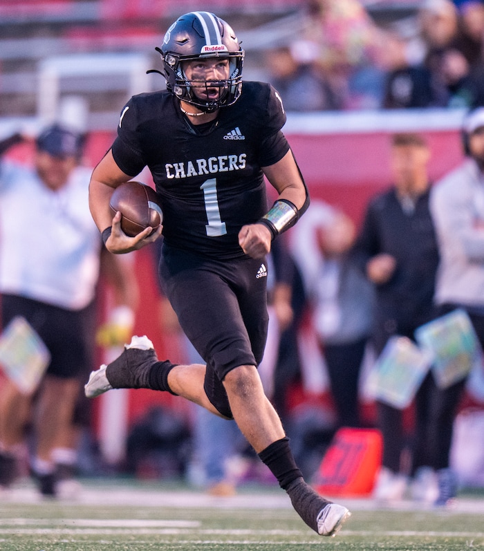 (Rick Egan | The Salt Lake Tribune) Corner Canyon QB Isaac Wilson (1), runs for a touchdown, in the Chargers 5A State championship win over the Skyridge Falcons, at Rice-Eccles Stadium, on Friday, Nov. 17, 2023.
