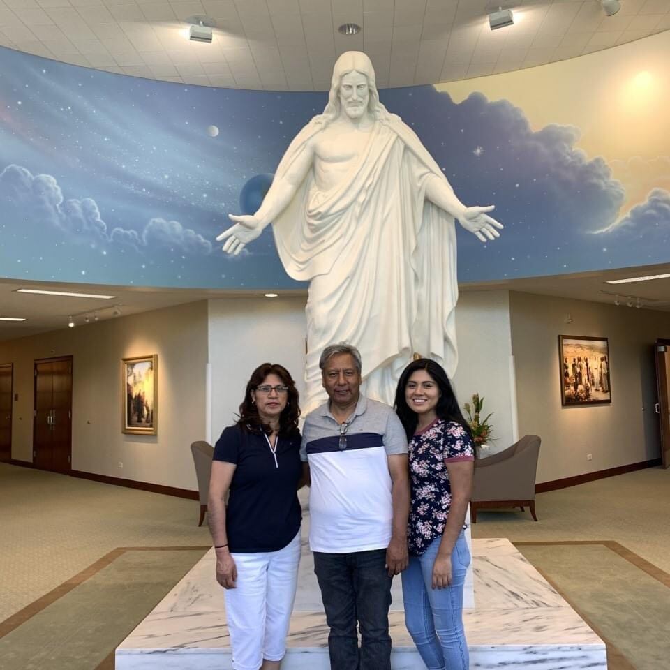(Courtesy of Yeraldine Calderone) Humbelina and Dario Ordóñez along with their daughter Belyruth are pictured by a Christus statue. Belyruth was found dead from a heat-related accident while hiking in Snow Canyon with her parents who are fighting for their lives after the hot hike. 