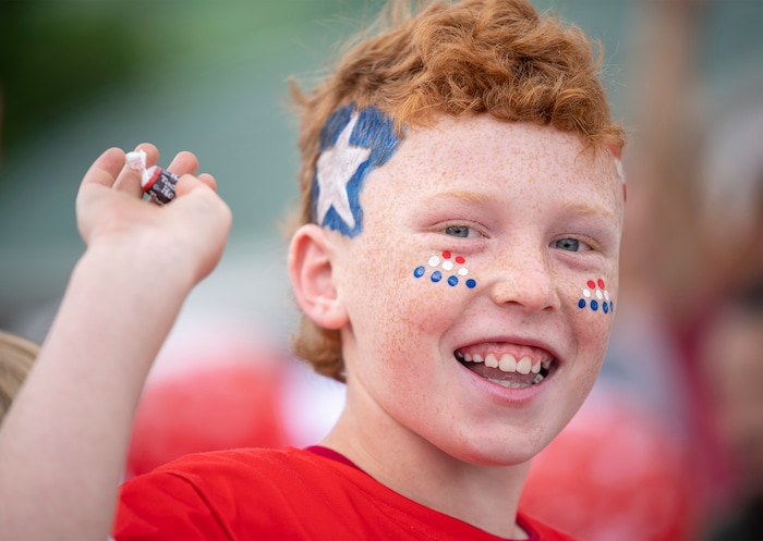 (Rick Egan | The Salt Lake Tribune) Kale Keys 11, tosses candy, during the Liberty Days parade in Liberty, Utah, on Tuesday, July 4, 2023.   