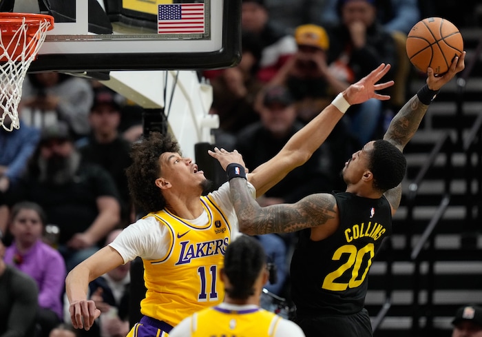 (Francisco Kjolseth  |  The Salt Lake Tribune) Los Angeles Lakers center Jaxson Hayes (11) reaches for the ball as Utah Jazz forward John Collins (20) tries to make a shot during an NBA basketball game Wednesday, Feb. 14, 2024, in Salt Lake City.