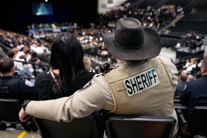 (Francisco Kjolseth  |  The Salt Lake Tribune) Law enforcement attends funeral services for Santaquin police Sgt. Bill Hooser at the UCCU Center at Utah Valley University on Monday, May 13, 2024.