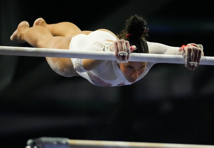 (Francisco Kjolseth  |  The Salt Lake Tribune) Amelie Morgan performs on the bars during the Pac-12 Gymnastics Championships, at the Maverik Center in West Valley City on Saturday, March 23, 2024.