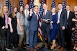 (Mark Schiefelbein | AP) House Speaker Mike Johnson, R-La., center left, poses during a ceremonial swearing-in with Rep.Mike Kennedy, R-Utah, center right, and members of Kennedy's family, in the Rayburn Room at the Capitol in Washington on Friday, Jan. 3, 2025.