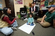 (Francisco Kjolseth  | The Salt Lake Tribune) Youth organizer Cynthia Ponce-Orellana brainstorms ideas to bringing a high school to the West side with Devin Martinez with daughter Belen, 2, and Alex Murphy. The Comunidades Unidas' Immigrant People's Agenda gathering, which looks to promote and advocate for immigrant rights, met in West Valley City on Friday, Nov. 1, 2024.