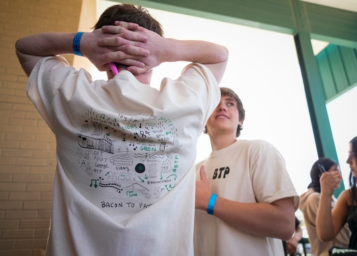 (Bethany Baker  |  The Salt Lake Tribune) Students wait for Kevin Bacon at a door to Payson High School after a charity event to commemorate the 40th anniversary of the movie "Footloose" in Payson on Saturday, April 20, 2024.