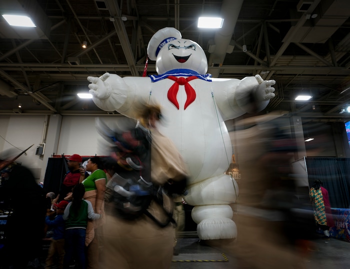 (Bethany Baker | Salt Lake Tribune) Crowds walk around a large inflatable Stay-Puft Marshmallow Man from “Ghostbusters” during FanX at Salt Palace Convention Center in Salt Lake City on Friday, Sept. 22, 2023.