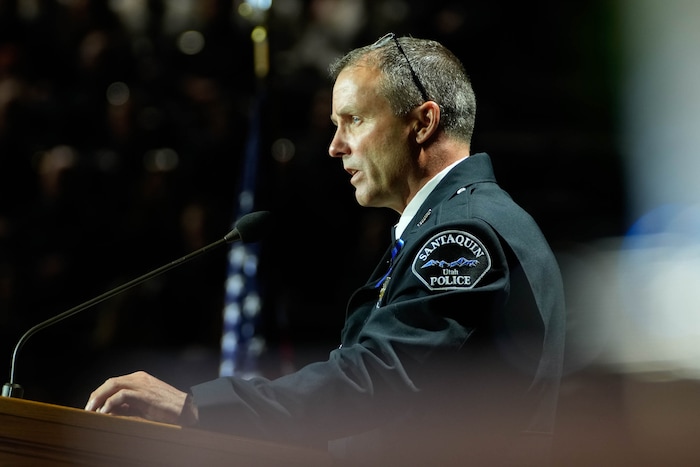 (Francisco Kjolseth  |  The Salt Lake Tribune) Santaquin police Chief Rod Hurst makes closing remarks during funeral services for Santaquin police Sgt. Bill Hooser at the UCCU Center at Utah Valley University on Monday, May 13, 2024.