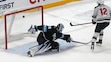 Minnesota Wild left wing Matt Boldy (12) scores against Utah Hockey Club goaltender Karel Vejmelka (70) during the shootout of an NHL hockey game Tuesday, Dec. 10, 2024, in Salt Lake City. (AP Photo/Rick Bowmer)