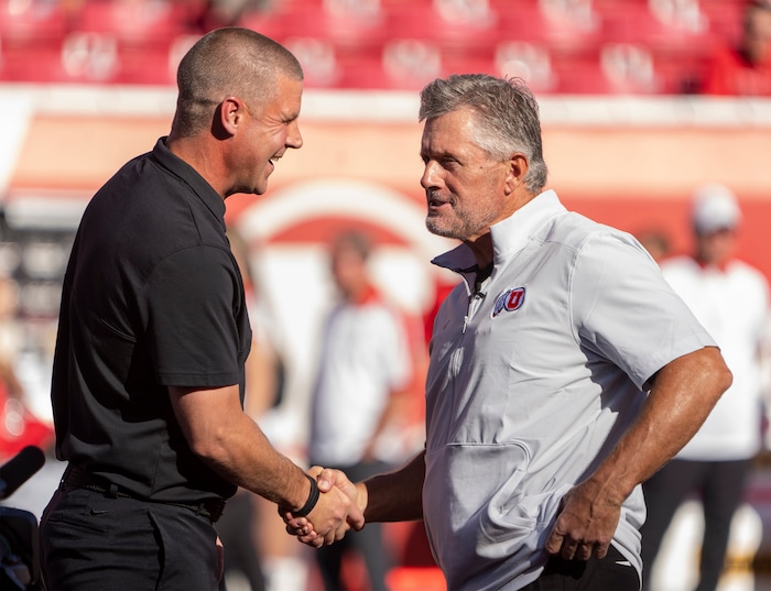 (Rick Egan | The Salt Lake Tribune) Utah Utes head coach Kyle Whittingham visits with Florida Gators head coach Billy Napier, before football action between the Utah Utes and the Florida Gators at Rice-Eccles Stadium on Thursday, Aug. 31, 2023.