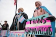 (Bethany Baker  |  The Salt Lake Tribune) Link Vasquez, left, a transgender male, and Cora Gardner, an LGBTQ ally, cheer during the Rally for Trans Community Support at the Capitol in Salt Lake City Friday, Jan. 24, 2025. A state commission has approved further restrictions, listed by sport, for transgender girls who want to compete in high school sports.