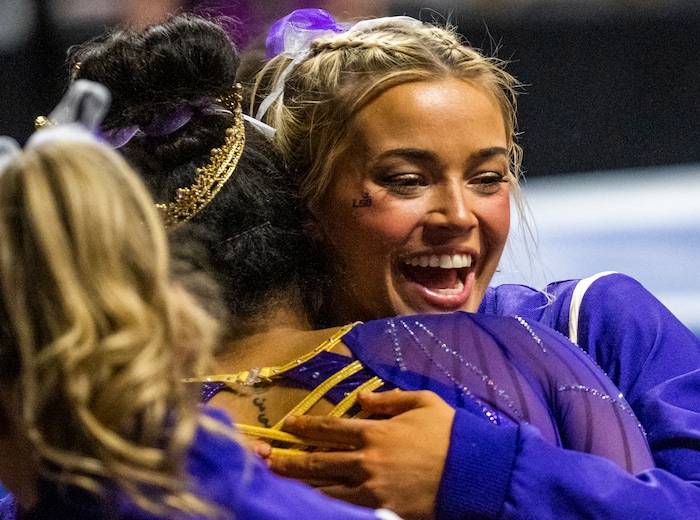 (Rick Egan | The Salt Lake Tribune)  LSU gymnast Livvy Dunne hugs Konnor McClain, during a gymnastics meet between Utah, LSU, Oklahoma and UCLA at the Maverik Center, on Saturday, Jan. 13, 2024.
