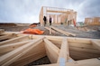 (Bethany Baker | The Salt Lake Tribune) Families work to build a house in Hyrum on Saturday, Feb. 8, 2025. The Neighborhood Nonprofit Housing Corp. makes homeownership attainable by having Utahns band together with future neighbors to build their own homes.