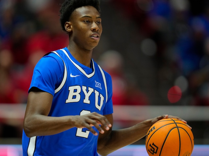 (Bethany Baker  |  The Salt Lake Tribune) Brigham Young Cougars guard Jaxson Robinson (2) brings the ball down the court at the Jon M. Huntsman Center in Salt Lake City on Saturday, Dec. 9, 2023.