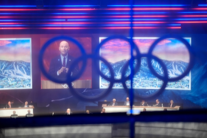 (David Goldman | AP) Utah Gov. Spencer Cox speaks about Salt Lake City's bid to host the 2034 Winter Olympics, during the 142nd IOC session at the 2024 Summer Olympics, Wednesday, July 24, 2024, in Paris.