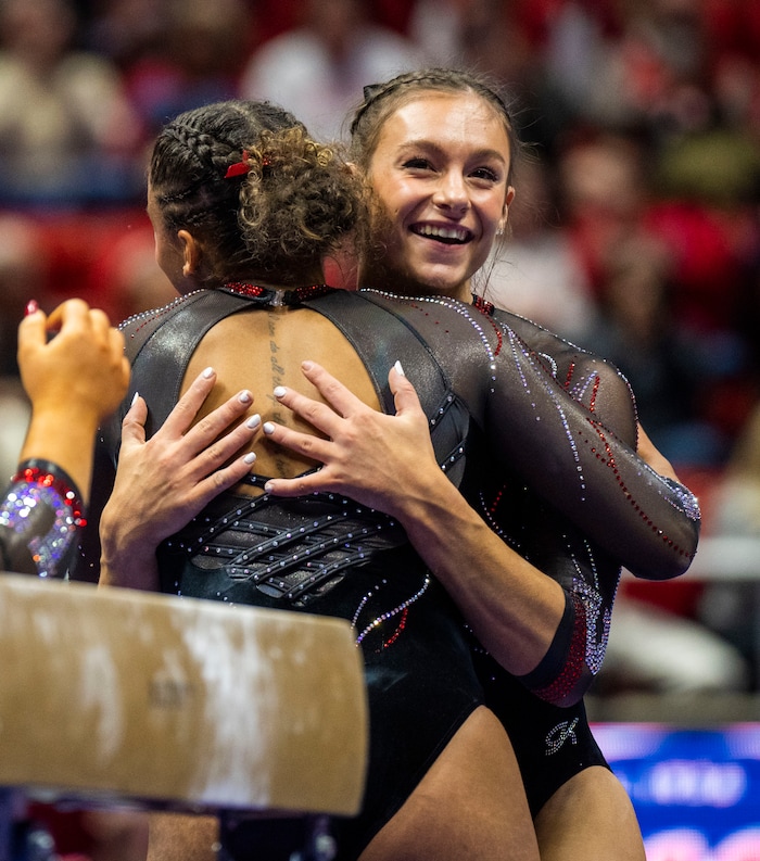 (Rick Egan | The Salt Lake Tribune)  Grace McCallum smiles after landing her dismount on the beam, in gymnastics action between Utah Red Rocks and Oregon State, at the Jon M. Huntsman Center, on Friday, Feb. 2, 2024.
