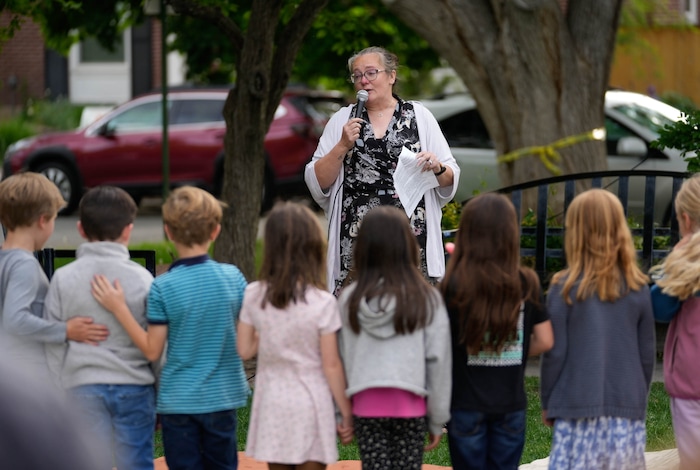 (Francisco Kjolseth  |  The Salt Lake Tribune) Annie Cowley, secretary at Uintah Elementary in Salt Lake City speaks during a candlelight memorial at Laird Park on Wednesday, May 22, 2024, to honor Adlai Owen. Police say Adlai’s father, Sam Owen, fatally shot Adlai before killing himself in an apparent murder-suicide on Saturday, May 18, 2024.